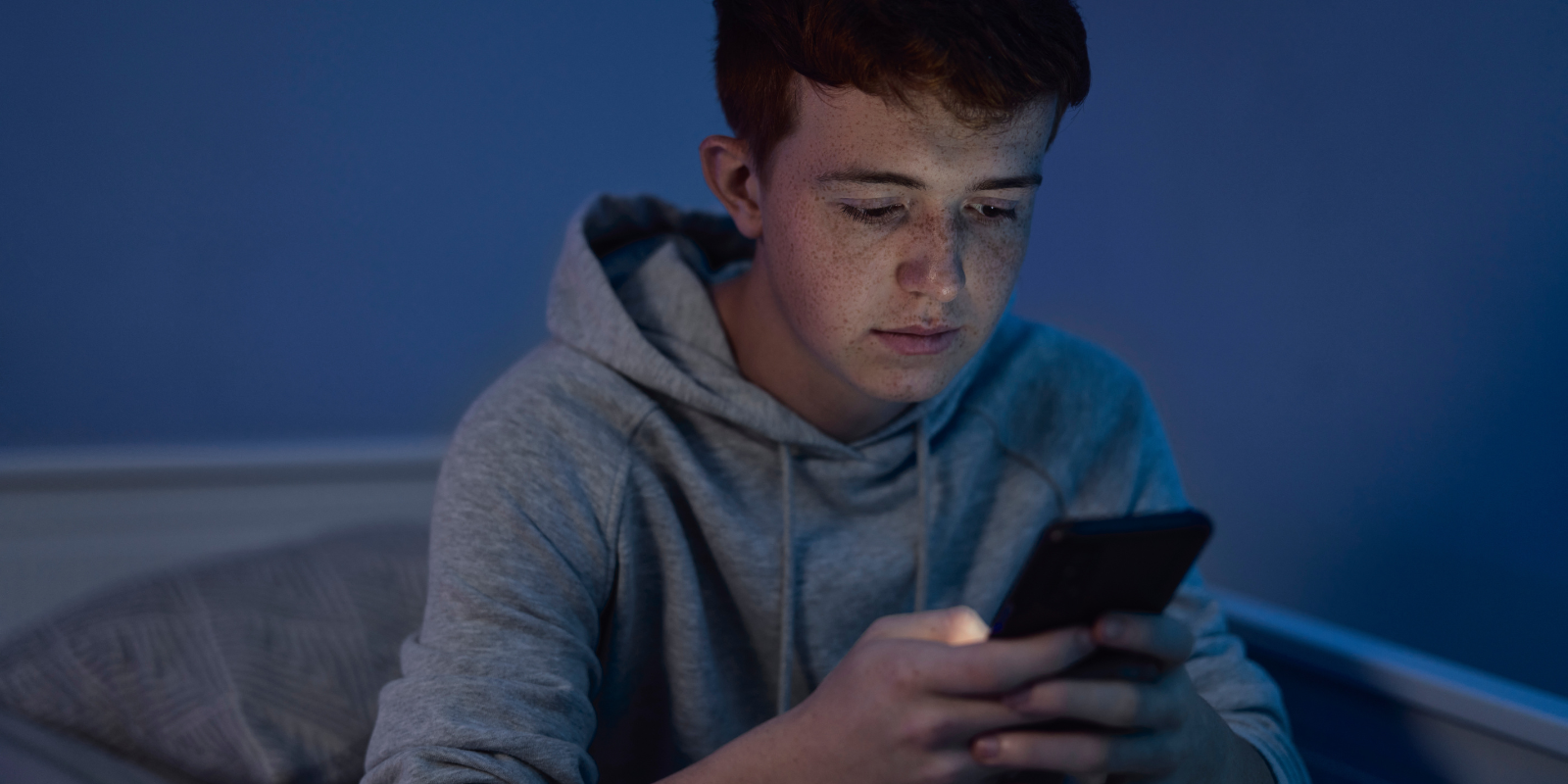 Teenage boy on his cell phone | The Boys Education Series